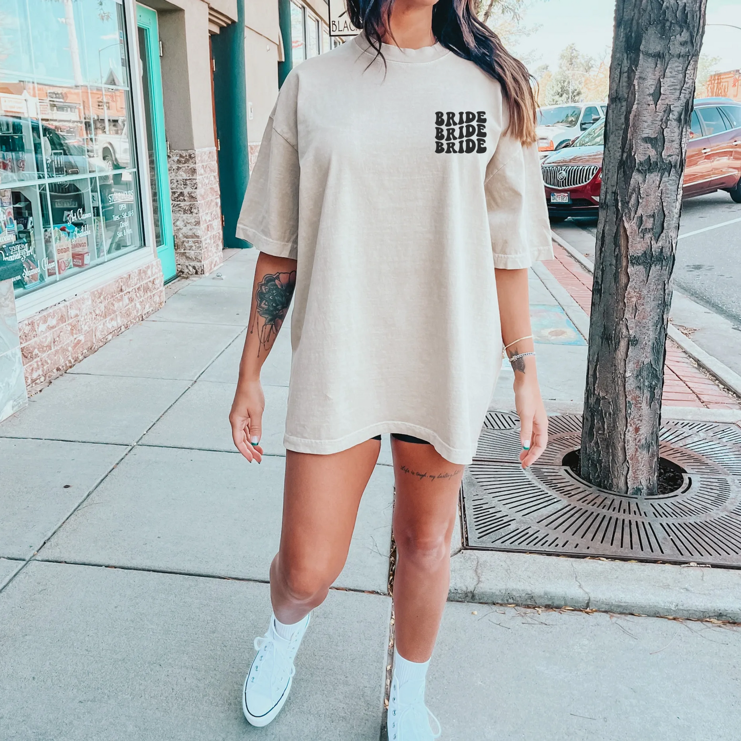 Oversized bride comfort colors shirt in ivory with words on back.